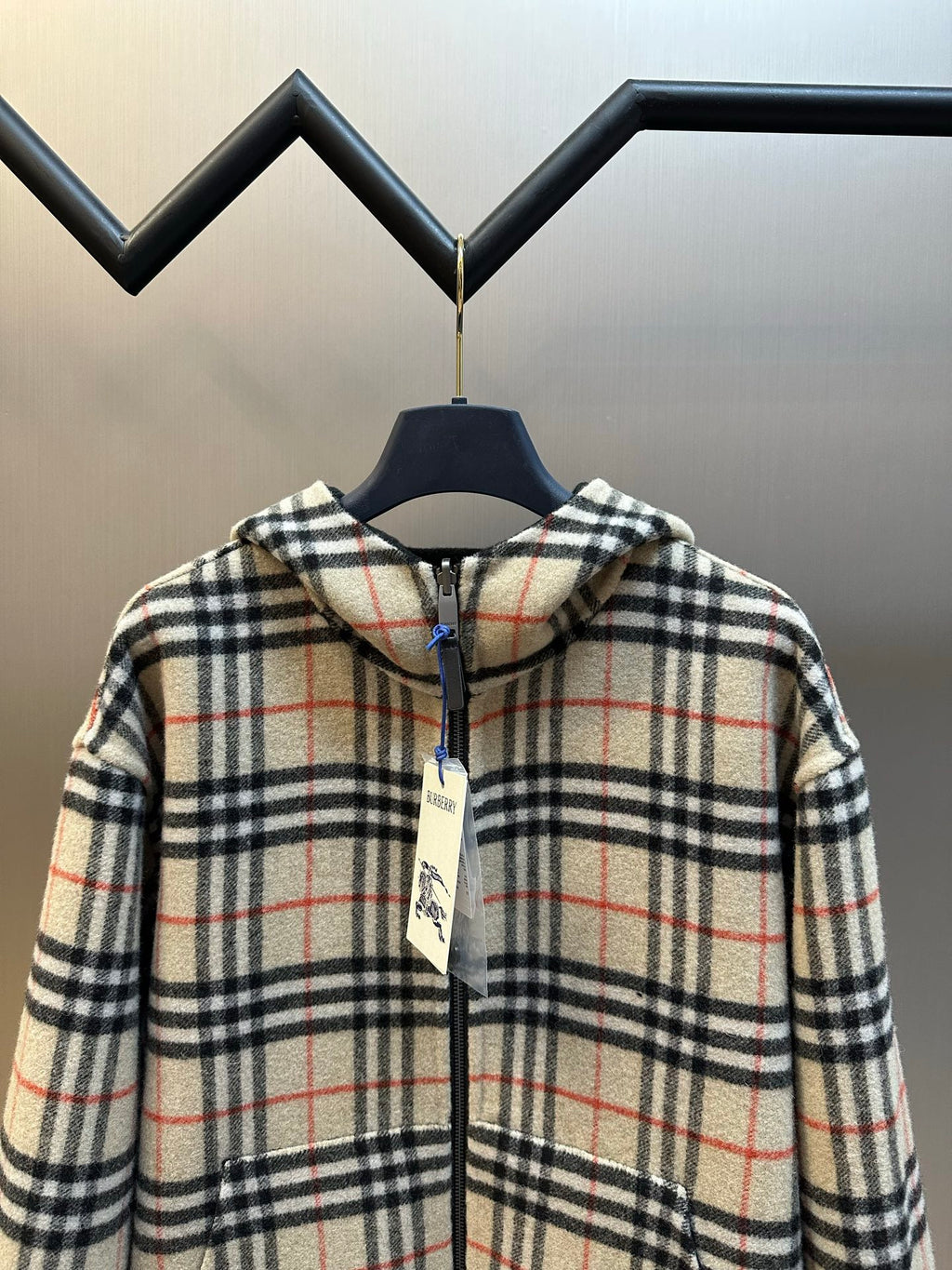 Burberry hooded plaid zip jacket close view, cream black and red check, blue drawcord