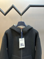 Burberry hooded zip jacket close view, dark charcoal, blue zipper pull and label