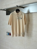 Beige short-sleeve polo shirt with buttoned collar and small chest logo
