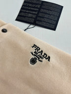 Beige polo shirt chest logo embroidery near the button placket