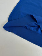 Blue polo shirt sleeve and ribbed hem detail