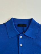 Blue polo shirt collar and button placket with Prada fabric tag