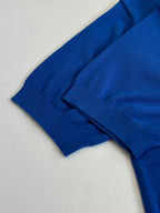 Blue polo shirt folded sleeve and ribbed cuff detail