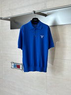 Blue short-sleeve polo shirt with Prada Milano logo on the chest