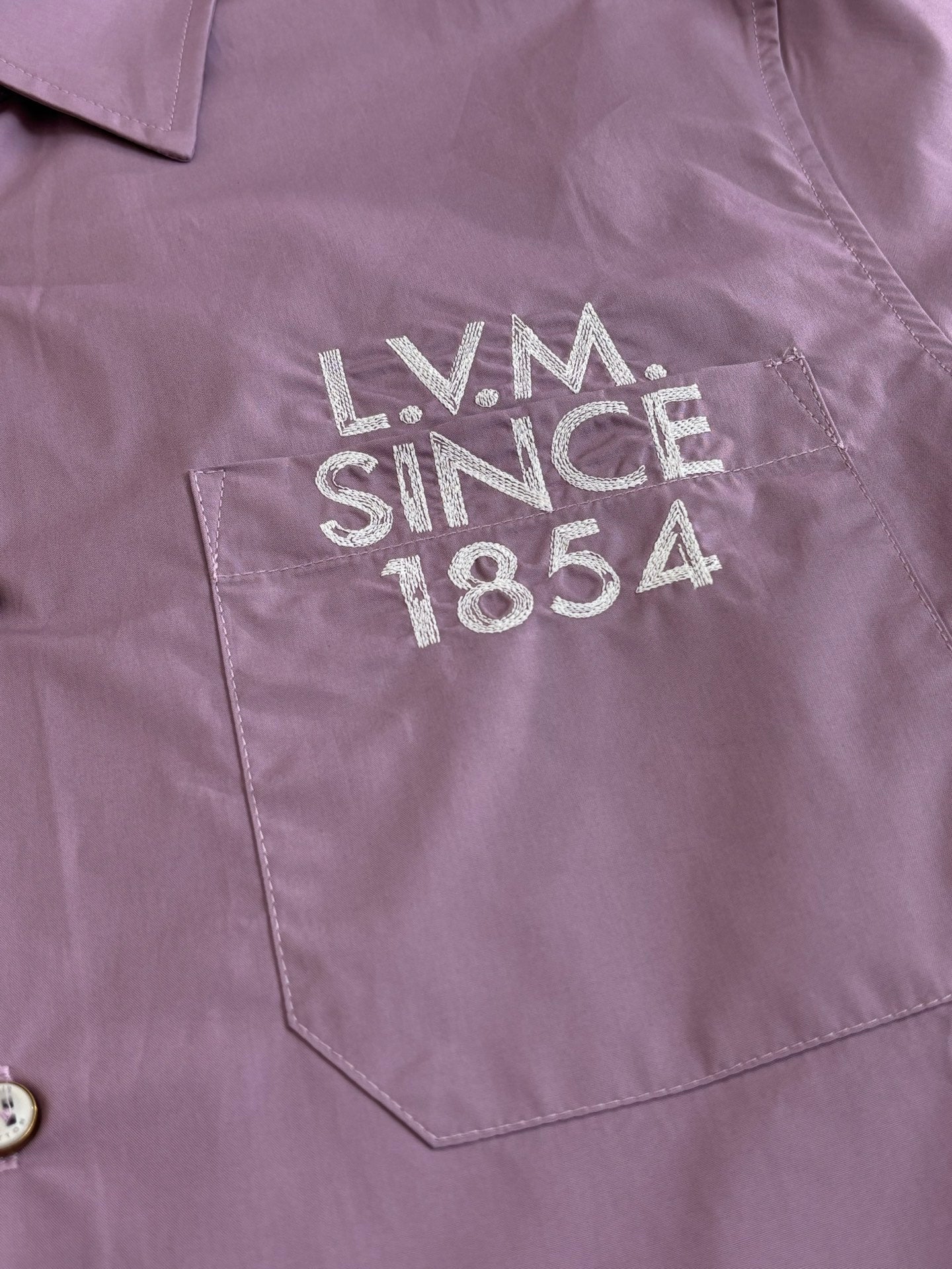 Louis Vuitton lilac shirt chest graphic reading LV M since 1854