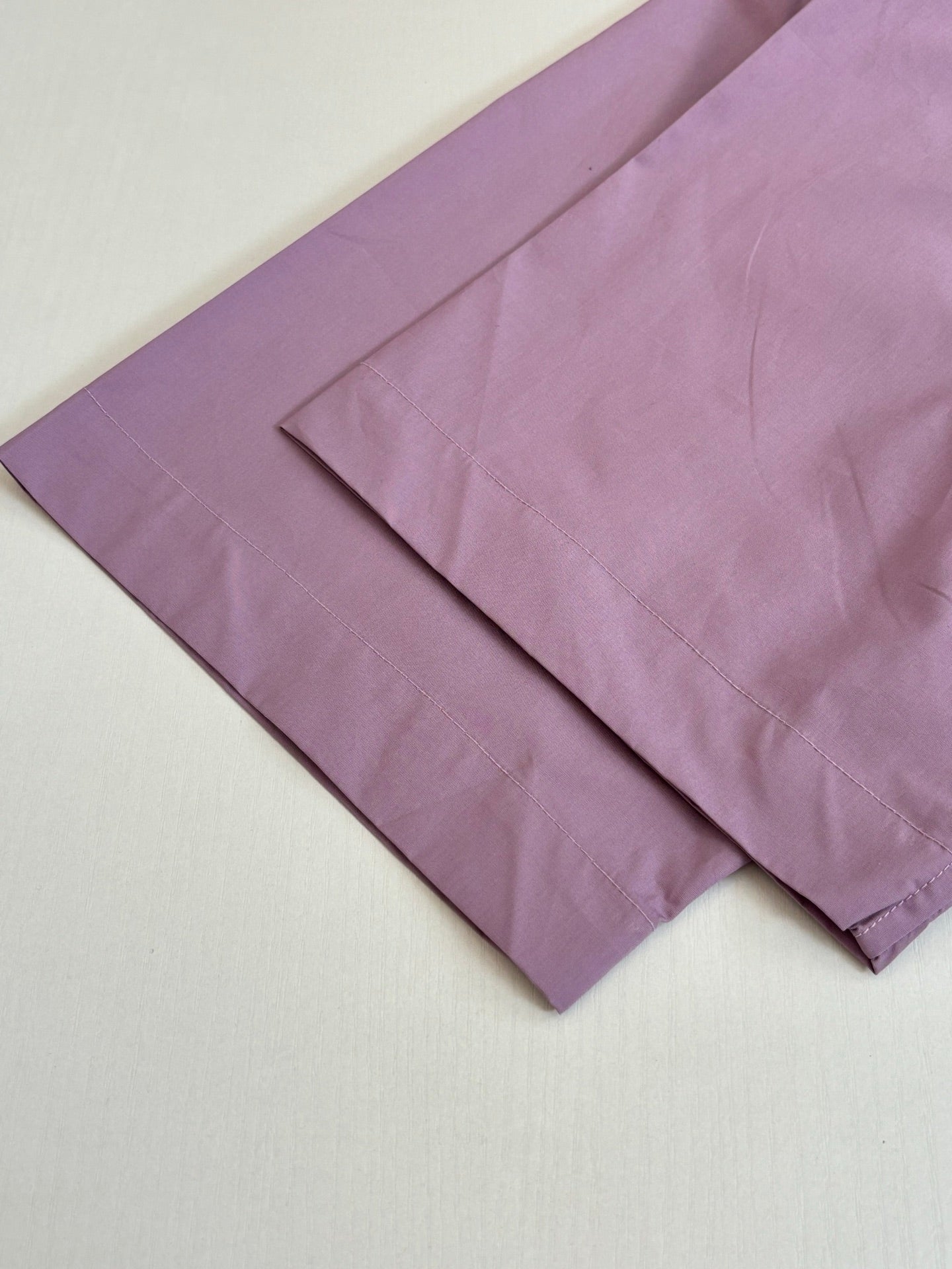 Louis Vuitton lilac shirt panels and straight hem edge, folded for display