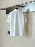 White short-sleeve button-up shirt, back view with button placket