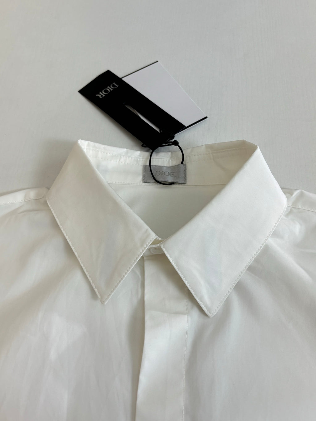 White button-up shirt collar and front placket, close-up