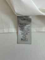 Inside label on white shorts with size and care instructions