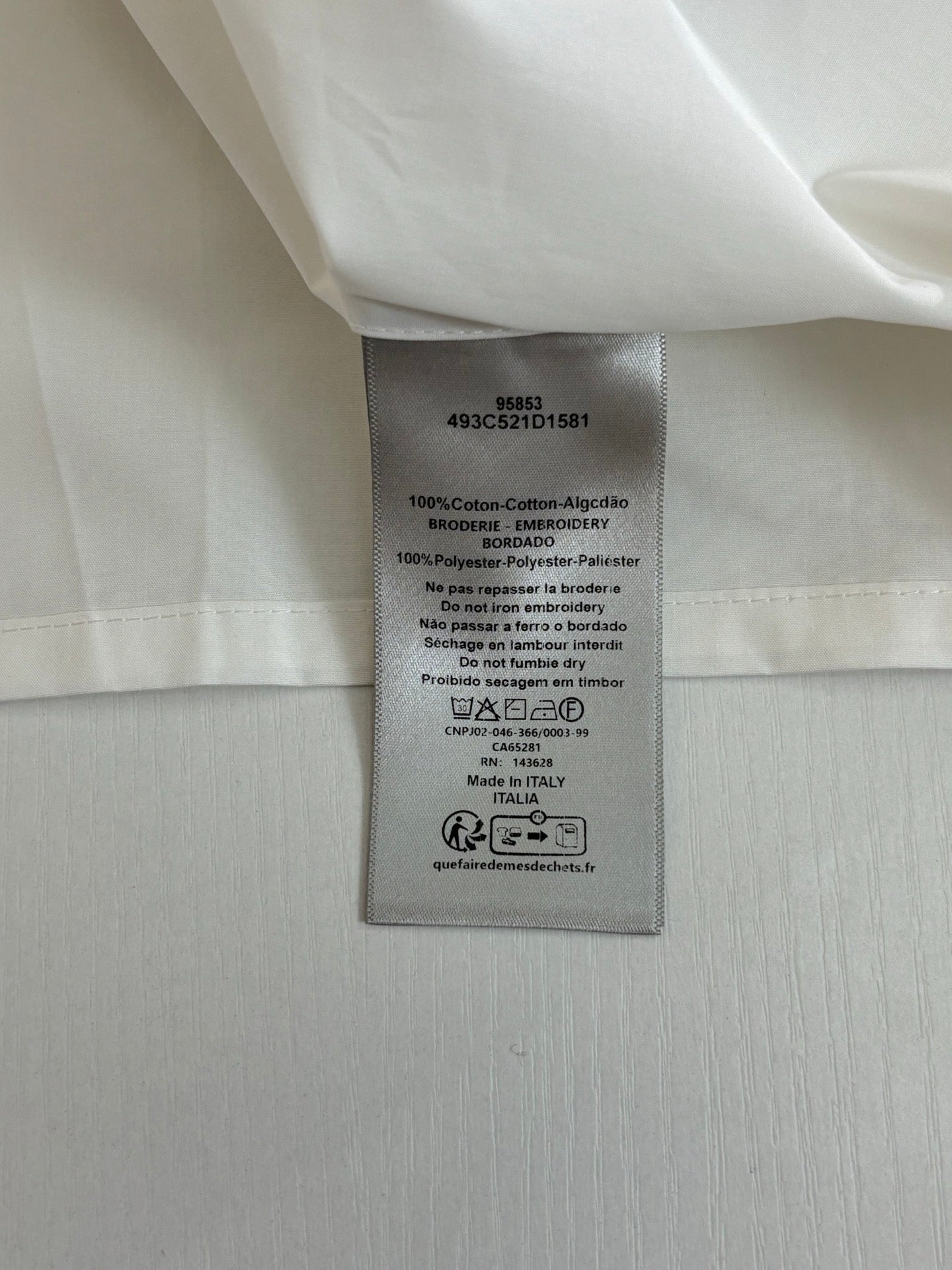 Inside label on white shorts with size and care instructions