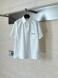 White short-sleeve button-up shirt with chest logo on pocket