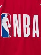 Red long-sleeve jersey back close-up showing NBA letters and basketball logo
