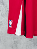Red long-sleeve jersey sleeve with NBA player logo and white side stripe
