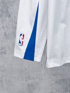White long-sleeve T-shirt with blue side panel and NBA patch on sleeve