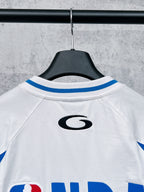 White long-sleeve T-shirt with blue-striped raglan shoulders and small back logo