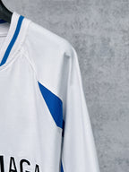 White long-sleeve T-shirt sleeve with blue diagonal stripe panel