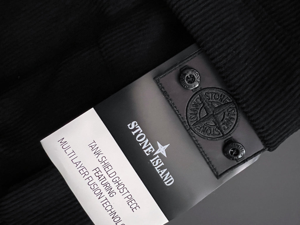 Stone Island fabric label patch on dark inner lining