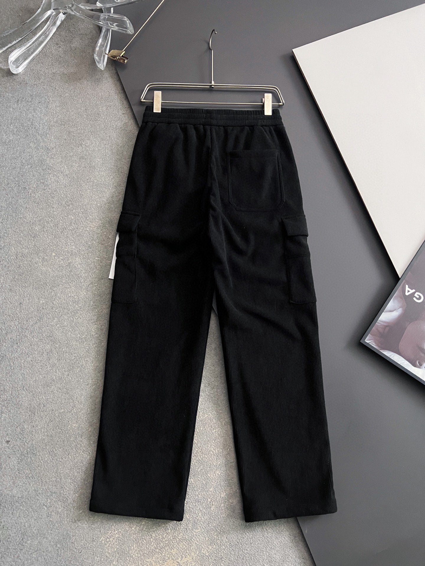 Black cargo pants with elastic waistband and drawstring, relaxed straight legs
