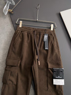 Brown cargo pants with cargo pockets, elastic waistband, and drawstring ties