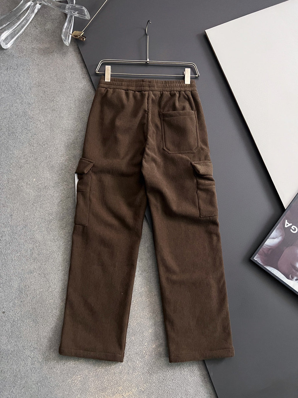 Brown cargo pants with elastic waistband and drawstring, cargo-style side pockets
