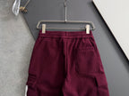 Burgundy cargo pants with elastic waistband, drawstring, and side cargo pocket