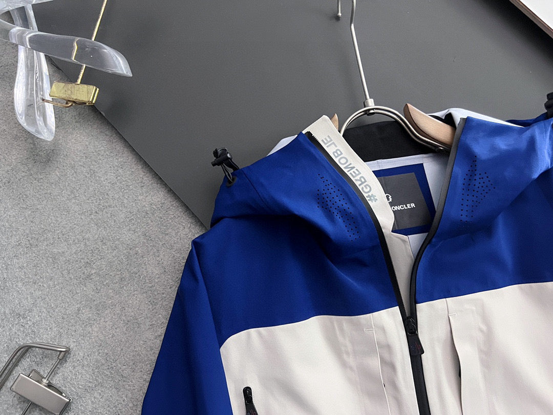 Moncler long hooded jacket front, blue with white stripe and zip closure