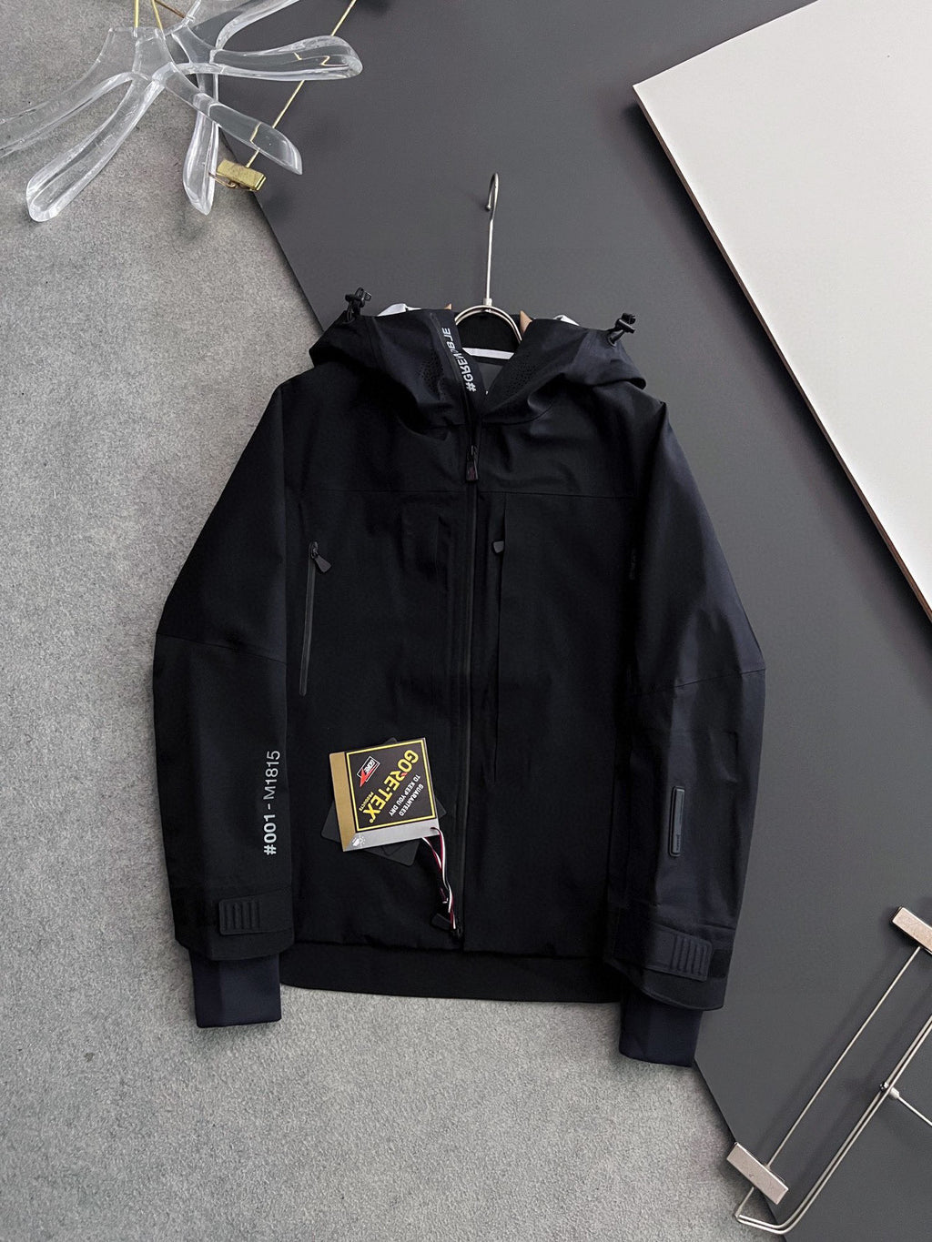 Moncler long hooded jacket, black with zip front and logo tag
