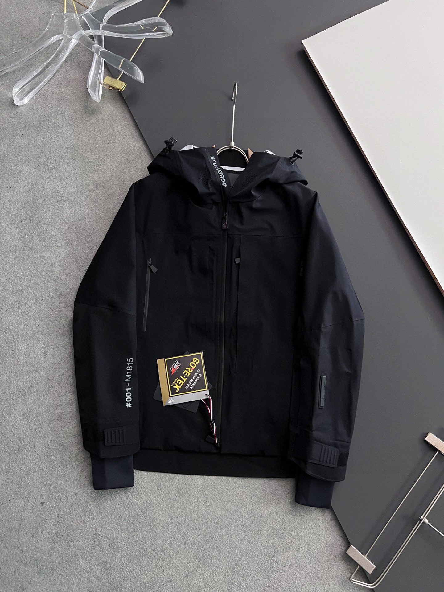 Moncler long hooded jacket, black with zip front and logo tag