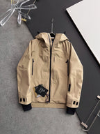 Moncler long hooded jacket, tan outer with white cuffs and zip front