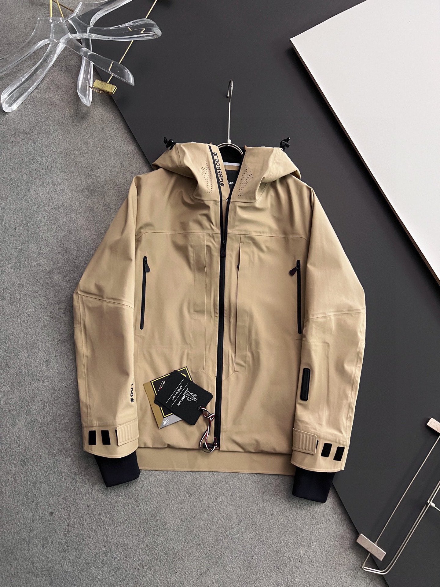 Moncler long hooded jacket, tan outer with white cuffs and zip front
