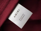 Inside neck tag showing AMIRI and 95% cotton, 5% spandex