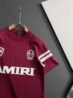Crewneck T-shirt in burgundy with striped sleeve cuffs and small chest crest