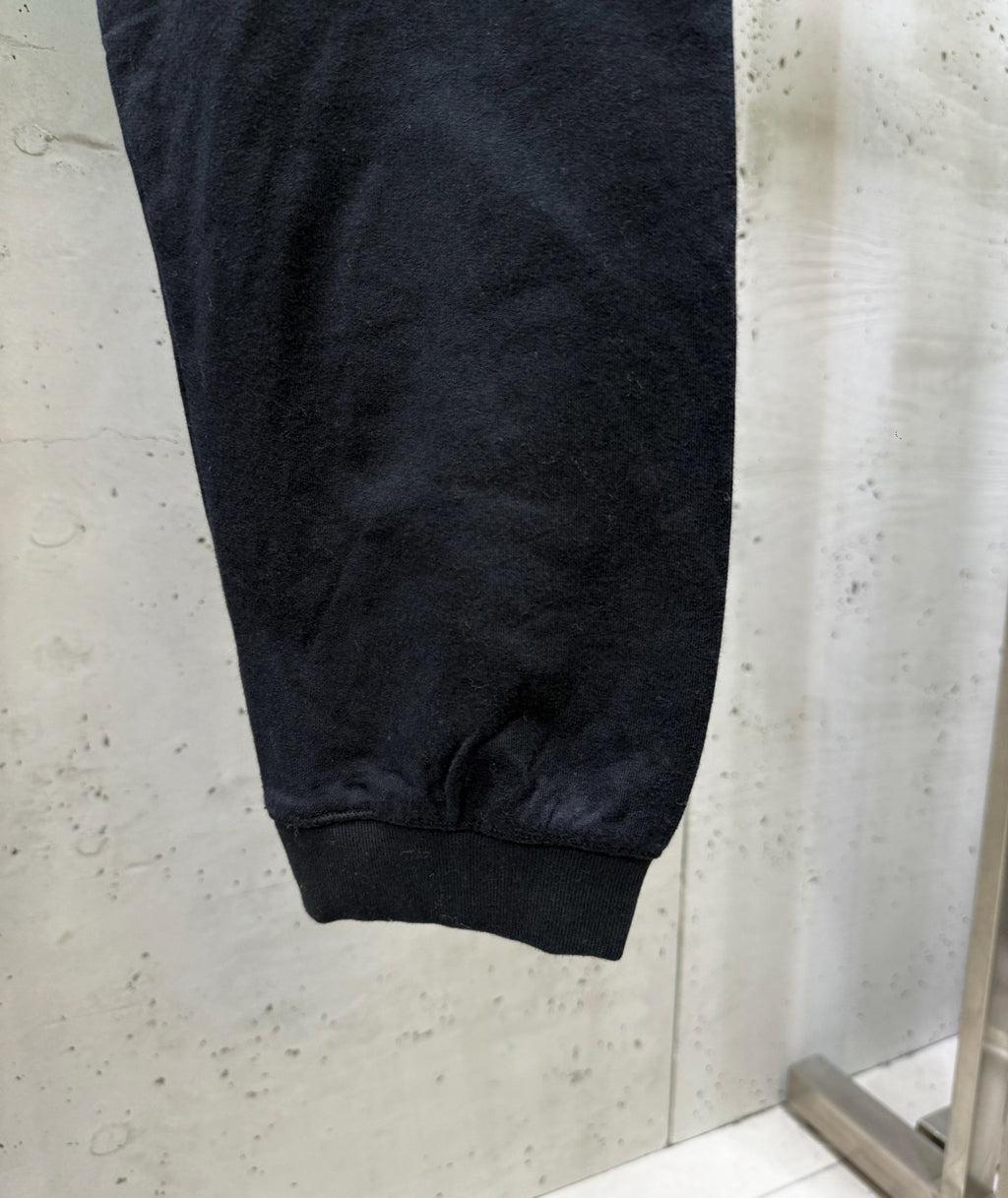 Black cargo pants cuffed ankle hem