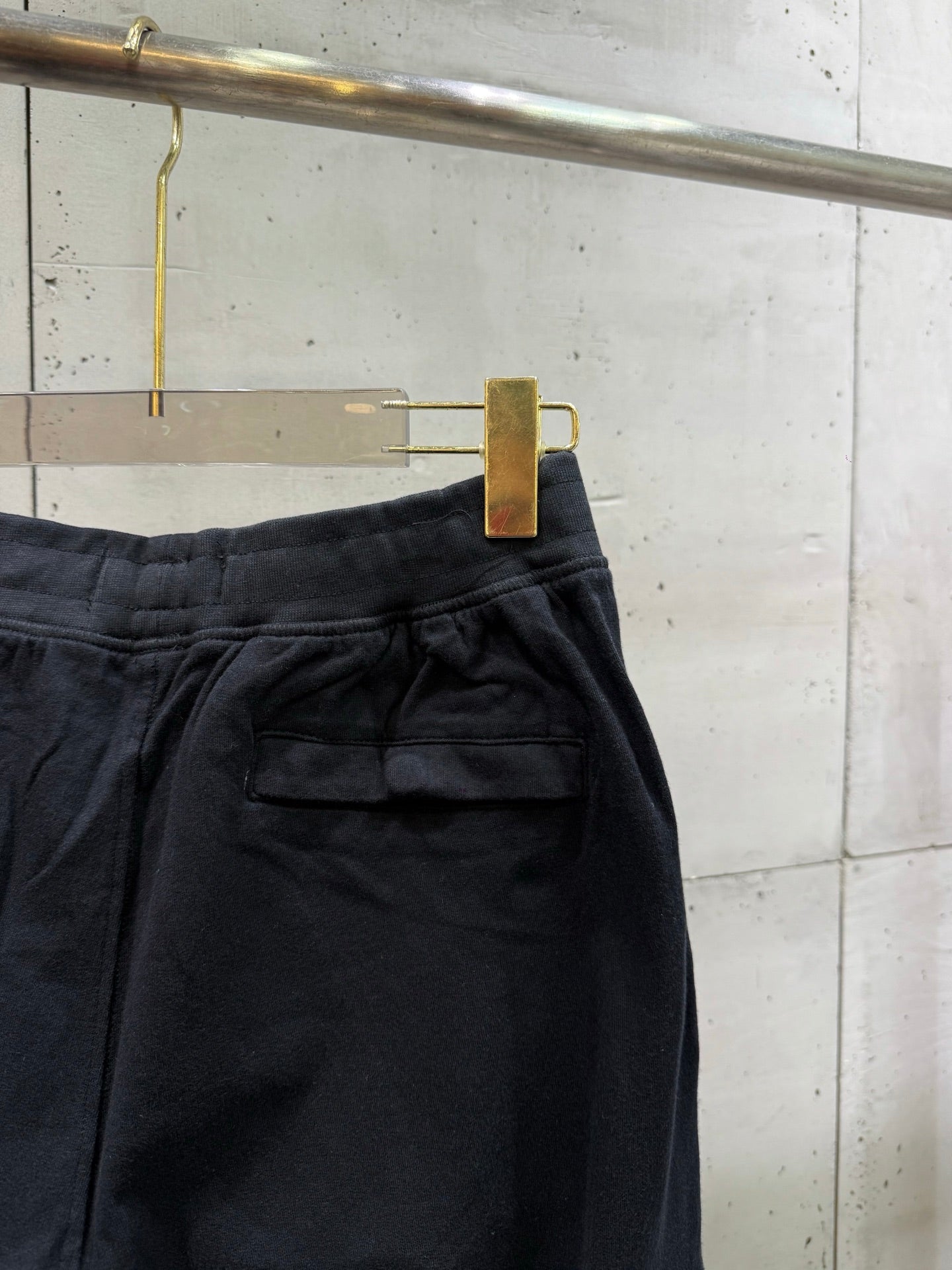 Black cargo pants with flap pocket and pleated waistband
