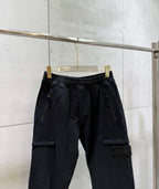 Black cargo pants with drawstring waistband and side cargo pocket