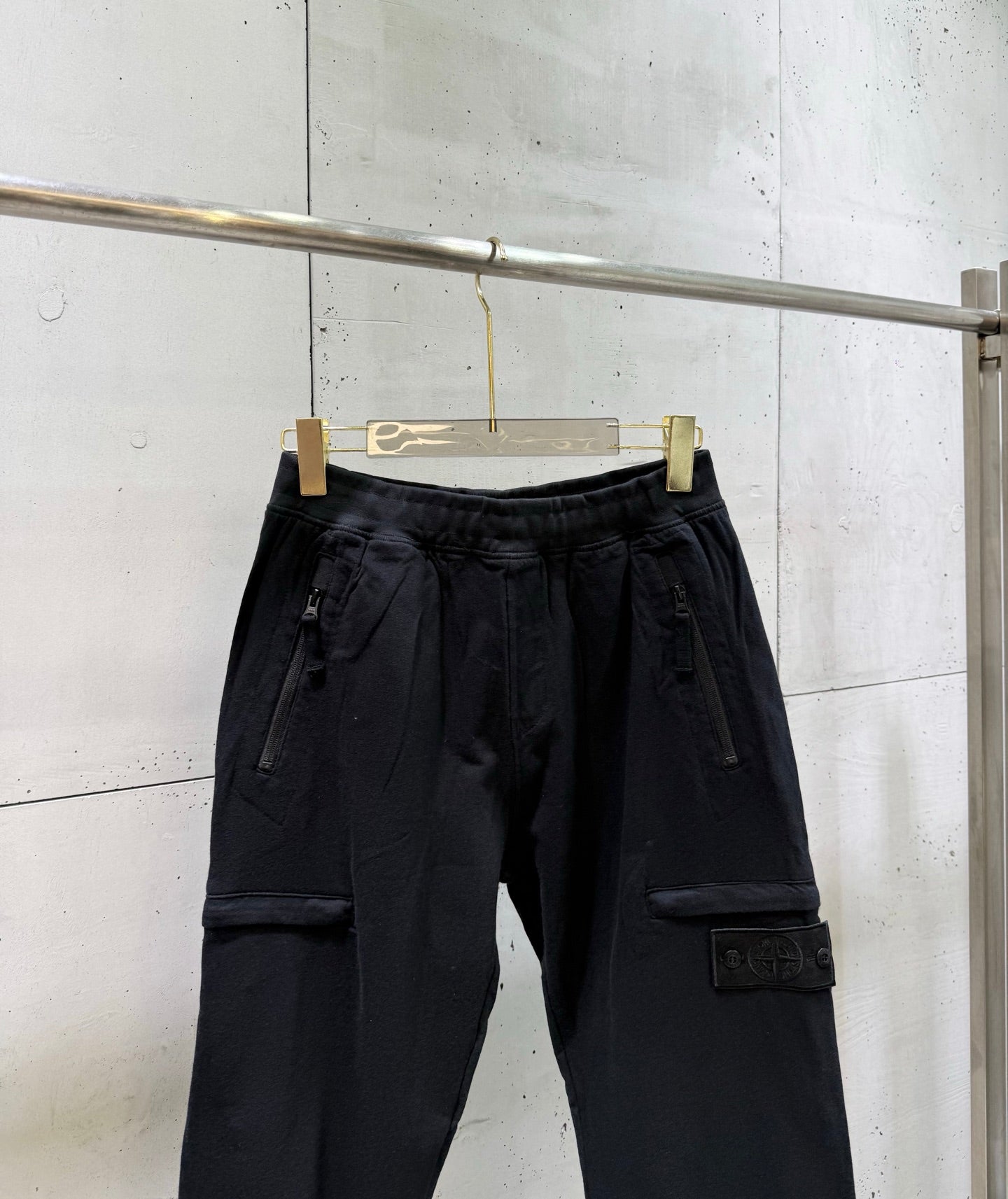 Black cargo pants with drawstring waistband and side cargo pocket
