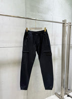 Black cargo pants with elastic waistband and flap side pockets
