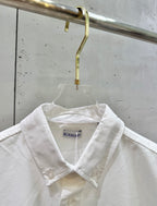 White button-up shirt neckline with Burberry label and collar