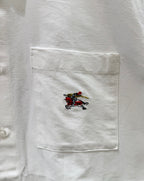 White shirt pocket with multicolor embroidered horse crest