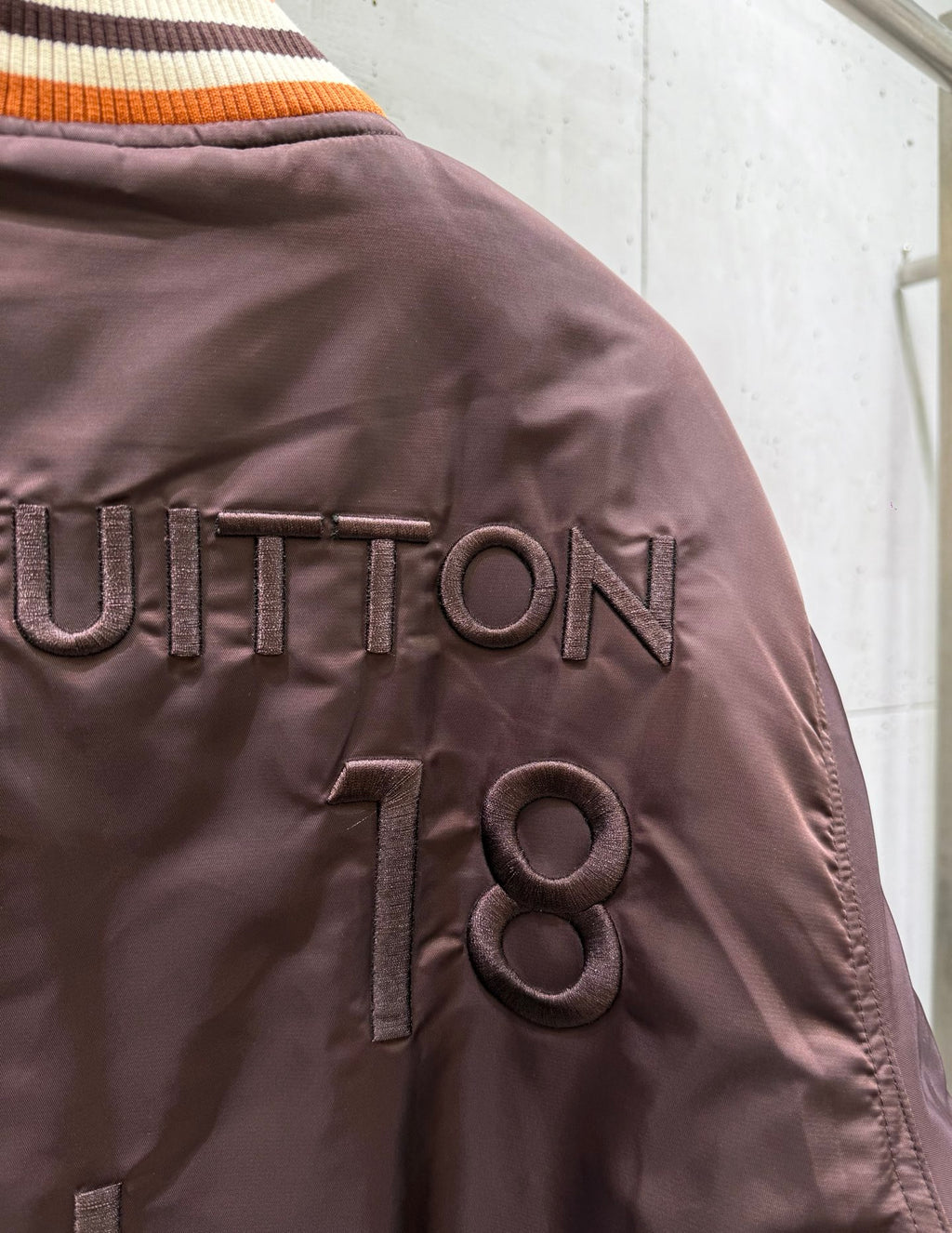 Long Louis Vuitton jacket with logo lettering and ribbed orange collar