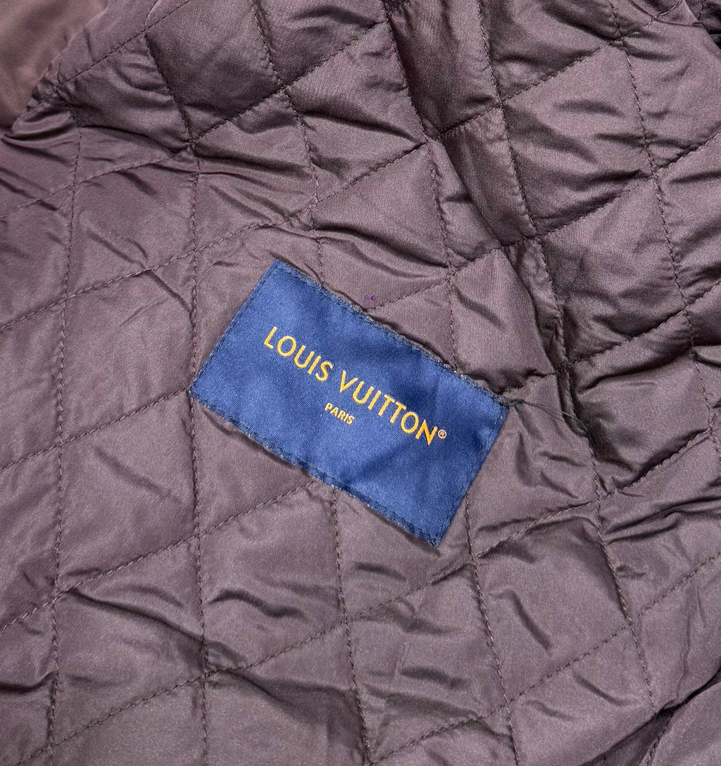 Louis Vuitton Paris fabric label on quilted burgundy bomber jacket lining