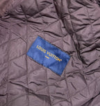 Louis Vuitton Paris fabric label on quilted burgundy bomber jacket lining