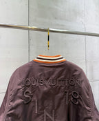 Burgundy bomber jacket back with Louis Vuitton text and large number graphic