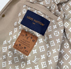 Louis Vuitton jacket inner tags on beige monogram floral lining with two fabric labels.
