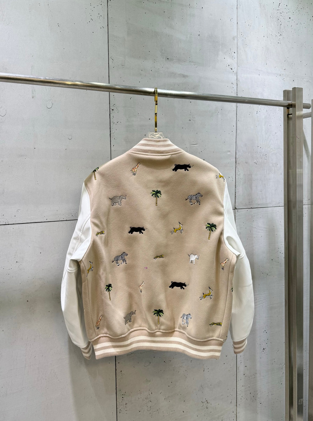 Louis Vuitton long-sleeve jacket back view with allover animal graphics and ribbed hem.