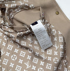 Louis Vuitton jacket inside lining with beige base and white monogram floral pattern.