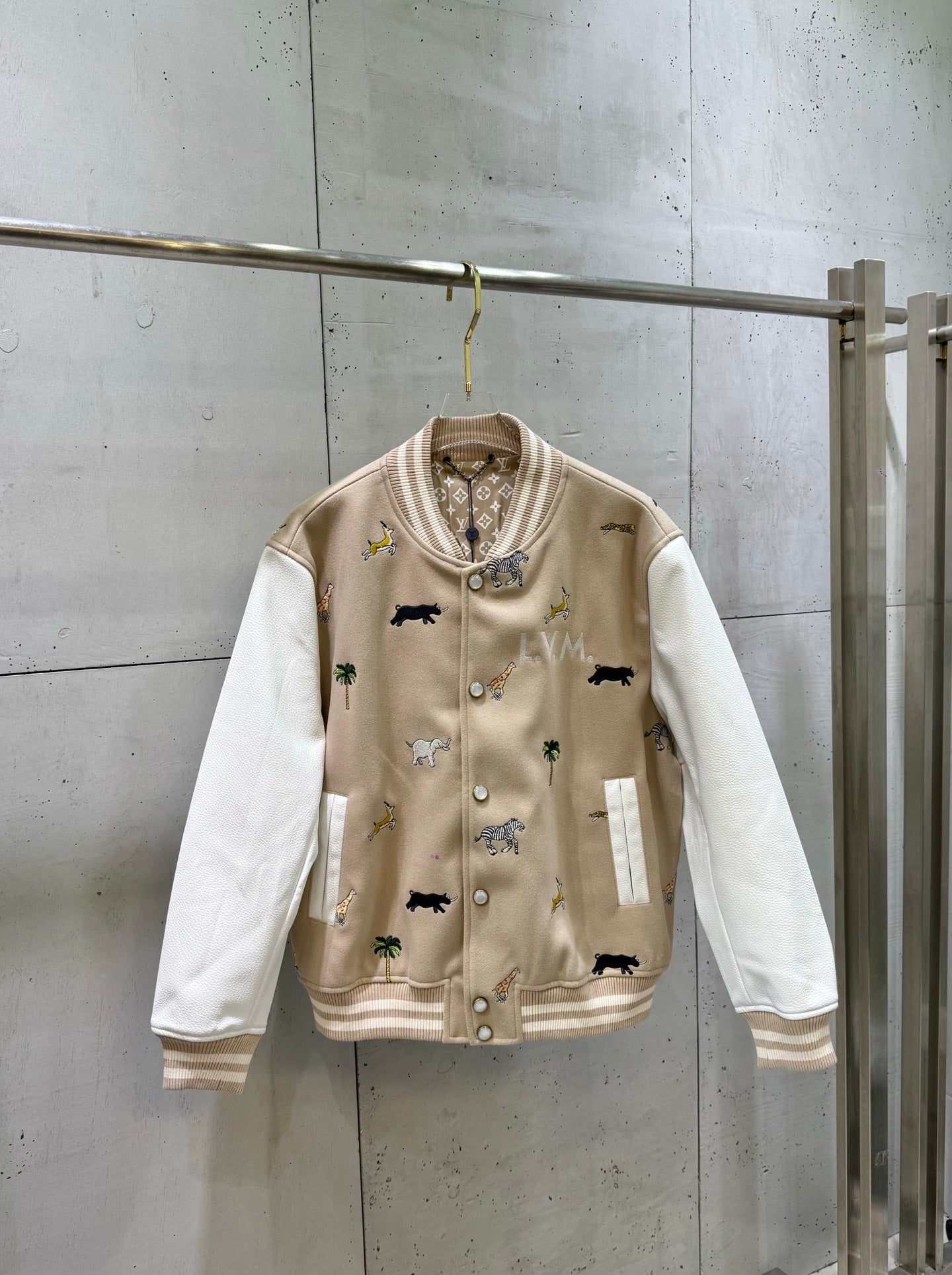 Louis Vuitton long-sleeve varsity jacket with animal-print graphics, button front.