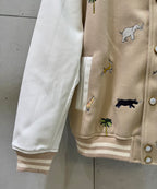 Louis Vuitton jacket sleeve and ribbed cuff with animal pattern and snap-button placket.