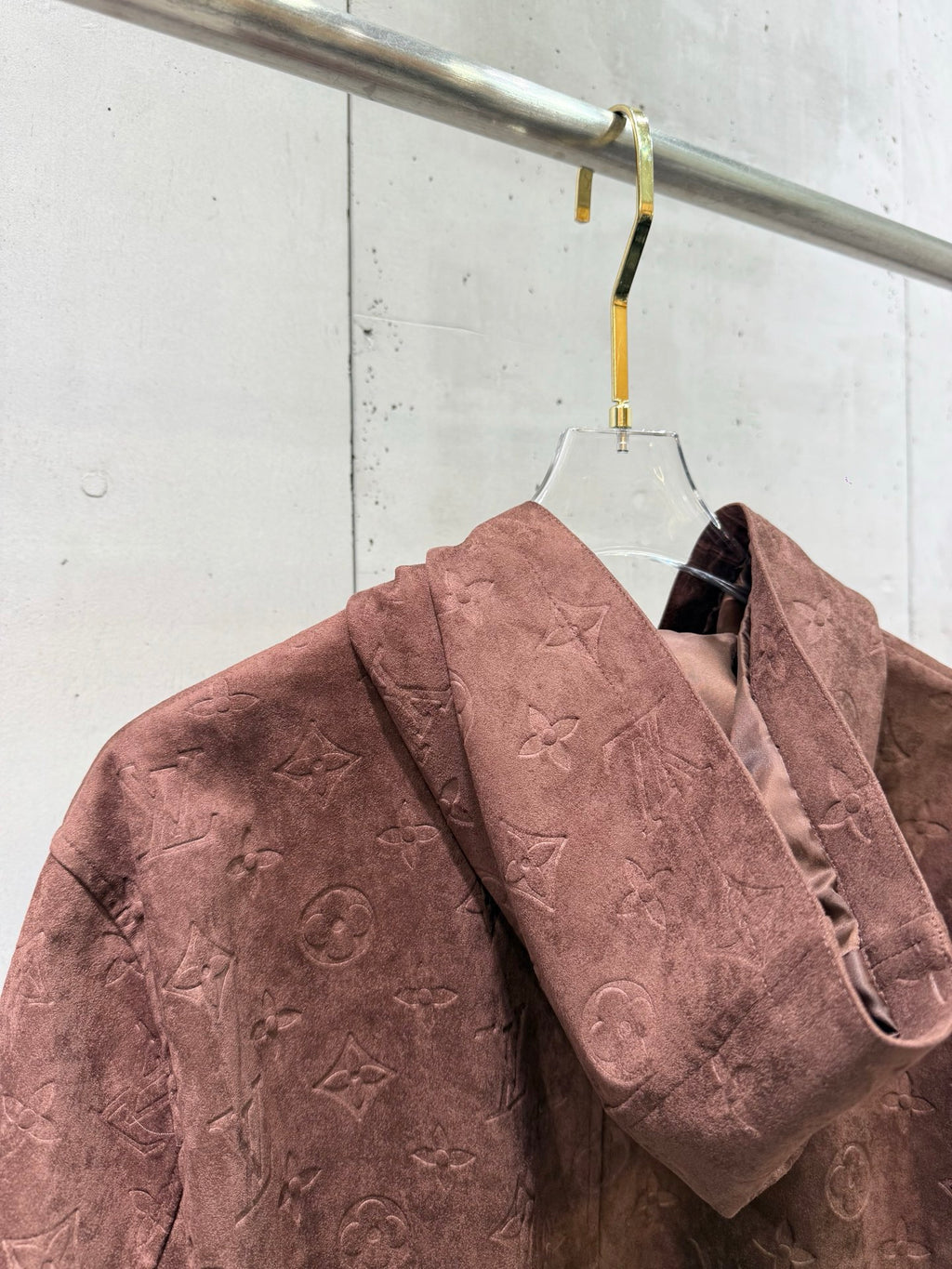 Louis Vuitton monogram hooded jacket, mauve-brown, folded over on hanger