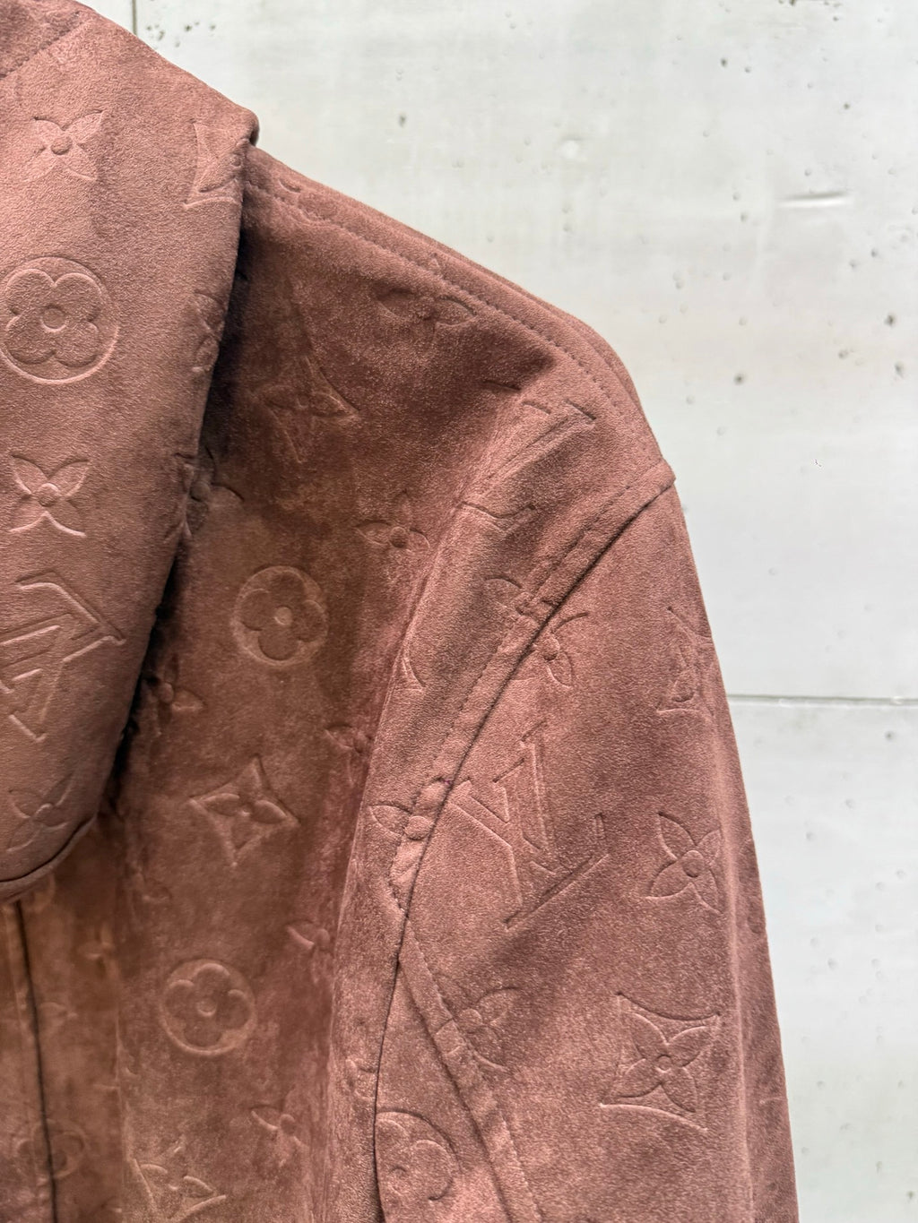 Louis Vuitton monogram jacket fabric panel, mauve-brown texture